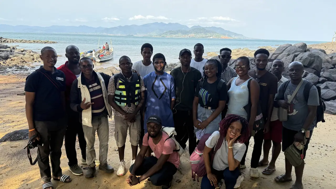 TpGroup team members on the beach